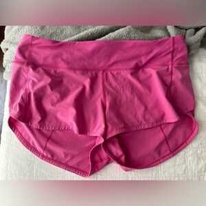 Size 8 lululemon shorts. 4 inch length. Hot pink. Good condition.
